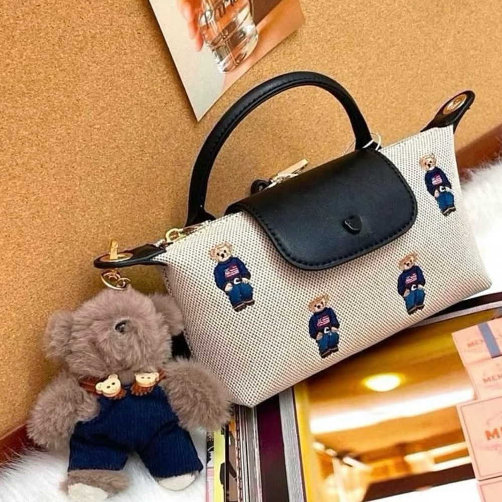 Chic Black and White Handbag with Bear Accents